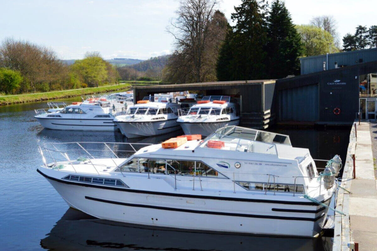 Hire boats moored at Caley Cruisers Inverness