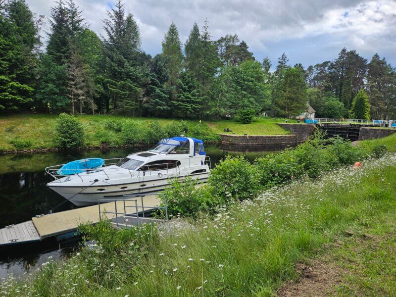 Boat at Kytra with Paddleboard on the bow